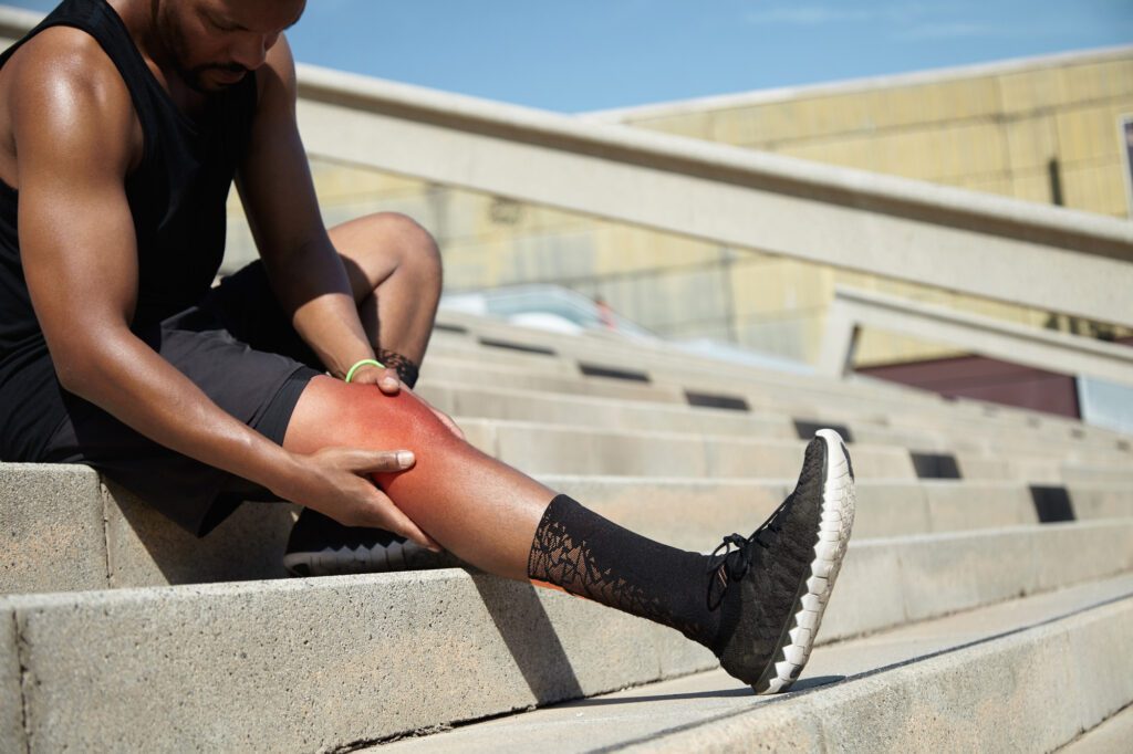 young man suffering from sports injuries