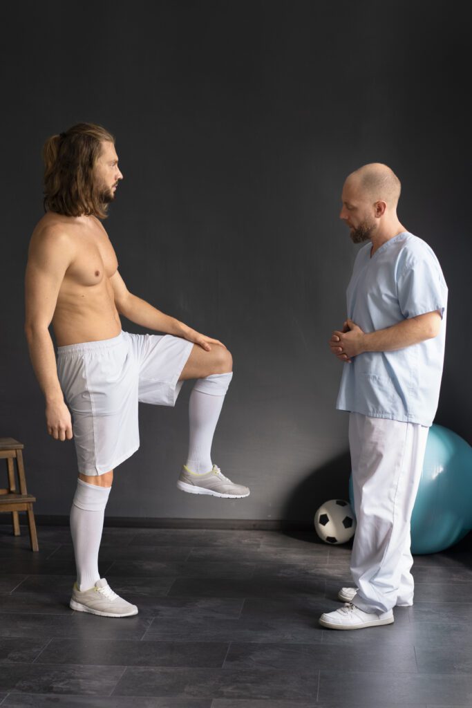 An orthopedic surgeon discussing treatment options with a professional athlete to prevent sports injuries and enhance performance.