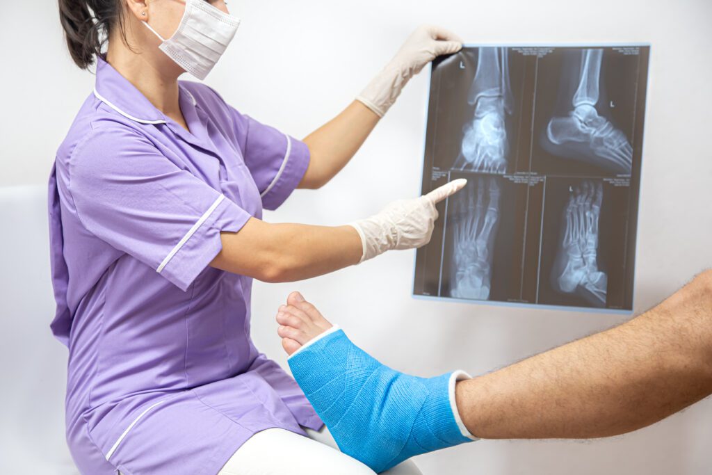 orthopedic surgeon helping patient relieve joint pain